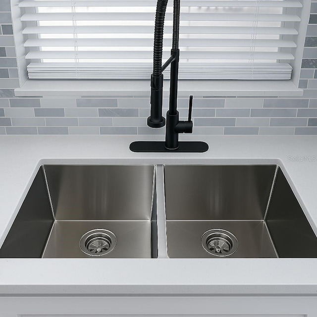 1302 Highview Rd, Brandon, FL 33510 - kitchen view of decorative backsplash and light countertops