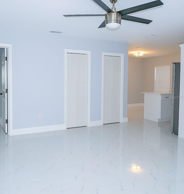 1302 Highview Rd, Brandon, FL 33510 - unfurnished living room featuring ceiling fan and light marble finish flooring