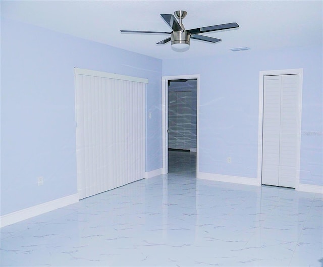 1302 Highview Rd, Brandon, FL 33510 - unfurnished room featuring marble look tiles and a ceiling fan