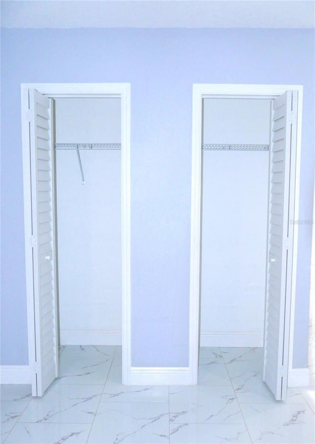 1302 Highview Rd, Brandon, FL 33510 - unfurnished bedroom with light marble finish floors