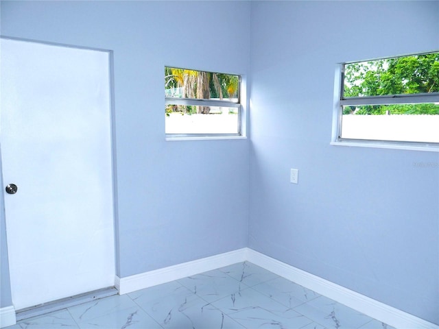 1302 Highview Rd, Brandon, FL 33510 - spare room with marble finish floors and plenty of natural light