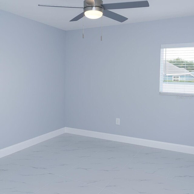 1302 Highview Rd, Brandon, FL 33510 - spare room with marble look tile flooring and a ceiling fan