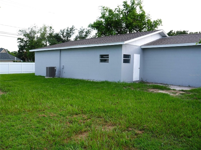 1302 Highview Rd, Brandon, FL 33510 - view of home's exterior featuring roof with shingles and a central air condition unit