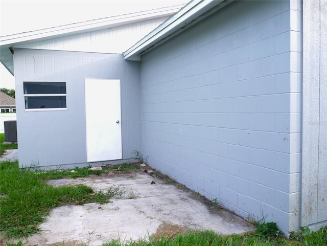 1302 Highview Rd, Brandon, FL 33510 - view of property exterior with concrete block siding and a patio