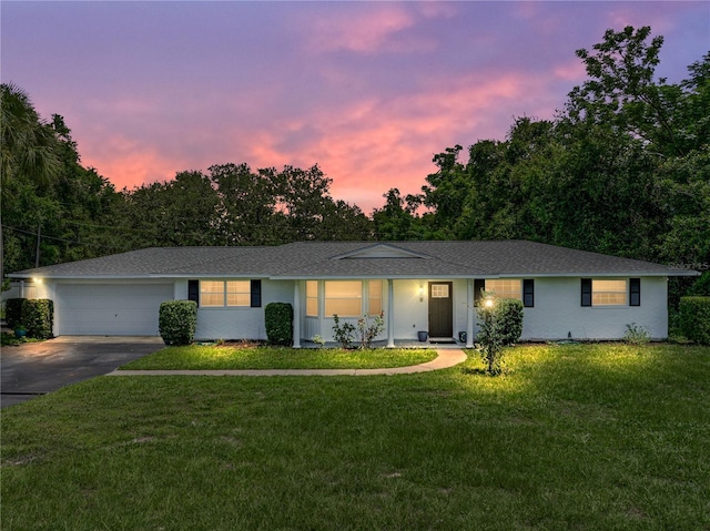 2937 Eagles Nest Rd, Fruitland Park, FL 34731 - ranch-style home with driveway, a front yard, and an attached garage