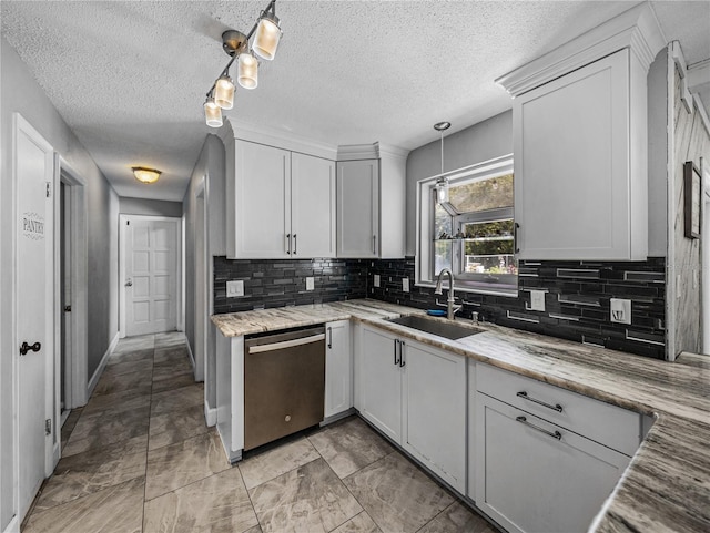 2937 Eagles Nest Rd, Fruitland Park, FL 34731 - kitchen with stainless steel dishwasher, decorative backsplash, white cabinets, hanging light fixtures, and a textured ceiling
