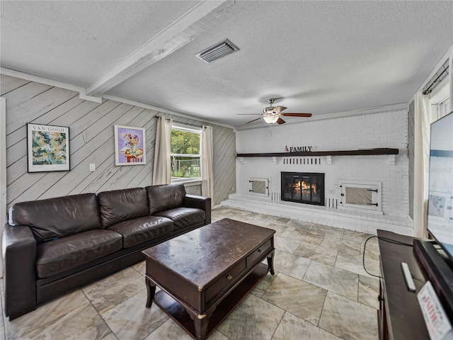 2937 Eagles Nest Rd, Fruitland Park, FL 34731 - living room with ceiling fan, a textured ceiling, a brick fireplace, beam ceiling, and wood walls