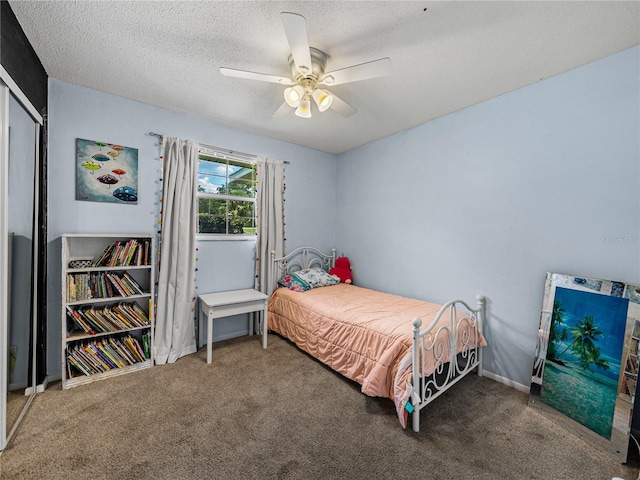 2937 Eagles Nest Rd, Fruitland Park, FL 34731 - bedroom with carpet, a textured ceiling, ceiling fan, and a closet