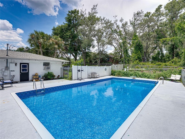 2937 Eagles Nest Rd, Fruitland Park, FL 34731 - view of swimming pool with a patio area, a diving board, and view of wooded area