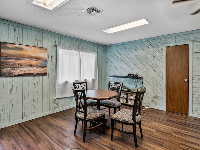 2937 Eagles Nest Rd, Fruitland Park, FL 34731 - dining area featuring wood finished floors, wood walls, a textured ceiling, and a skylight