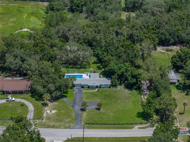 2937 Eagles Nest Rd, Fruitland Park, FL 34731 - aerial overview of property's location featuring a pool and a heavily wooded area