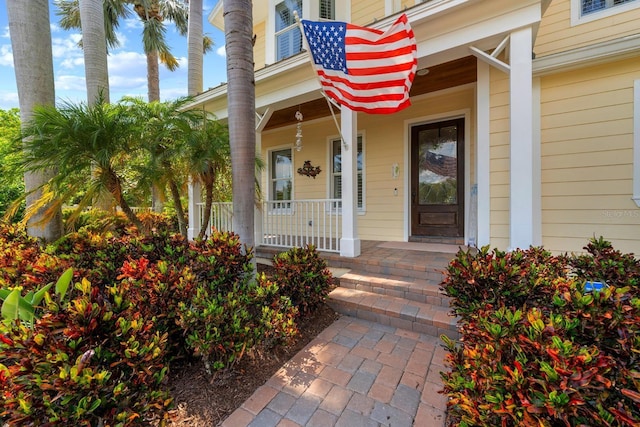 703 Islebay Dr, Apollo Beach, FL 33572 - property entrance with a porch