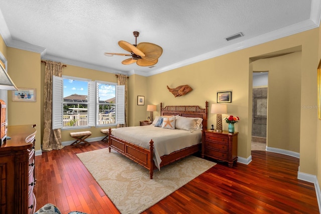 703 Islebay Dr, Apollo Beach, FL 33572 - bedroom with hardwood / wood-style flooring, a textured ceiling, ornamental molding, and ceiling fan