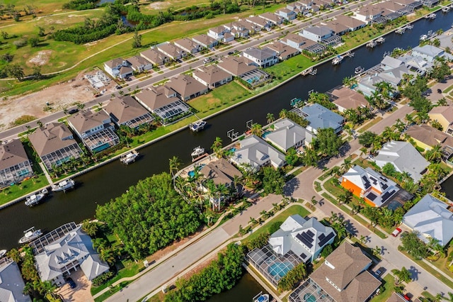 703 Islebay Dr, Apollo Beach, FL 33572 - aerial overview of property's location featuring nearby suburban area and a nearby body of water
