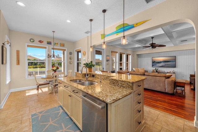 703 Islebay Dr, Apollo Beach, FL 33572 - kitchen featuring dishwasher, stone tile flooring, pendant lighting, cream cabinetry, and recessed lighting