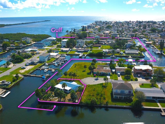 13534 Evelane Dr, Hudson, FL 34667 - aerial view of residential area featuring a large body of water and property parcel outlined