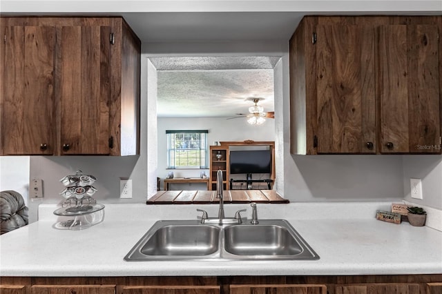 2719 N 91 Mine Rd, Bartow, FL 33830 - kitchen featuring light countertops, a ceiling fan, dark brown cabinets, and a textured ceiling