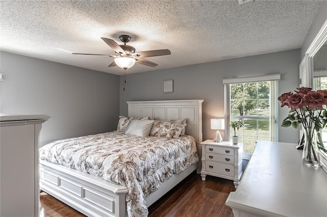 2719 N 91 Mine Rd, Bartow, FL 33830 - bedroom with dark wood finished floors, a textured ceiling, and a ceiling fan