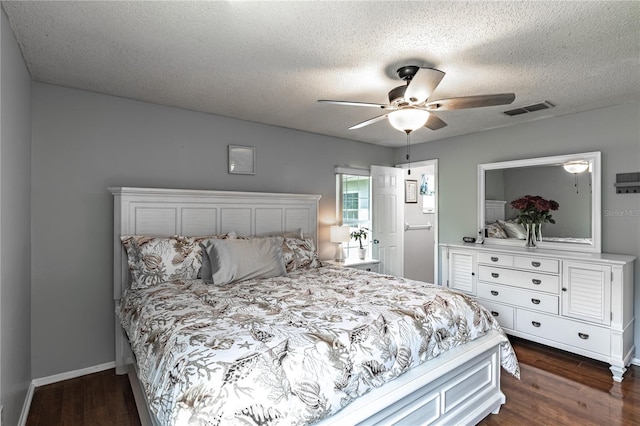 2719 N 91 Mine Rd, Bartow, FL 33830 - bedroom featuring dark wood-style floors, a textured ceiling, and a ceiling fan