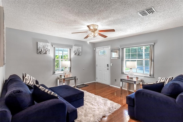 2719 N 91 Mine Rd, Bartow, FL 33830 - living area featuring a ceiling fan, wood finished floors, and a textured ceiling