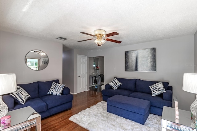 2719 N 91 Mine Rd, Bartow, FL 33830 - living area featuring a ceiling fan, wood finished floors, and a textured ceiling