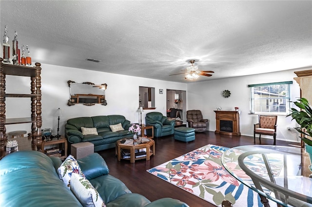 2719 N 91 Mine Rd, Bartow, FL 33830 - living area with a textured ceiling, wood finished floors, and a ceiling fan