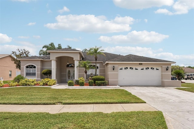 8704 Cypress Lakes Blvd, New Port Richey, FL 34653 - view of front of property featuring stucco siding, driveway, an attached garage, a front lawn, and a shingled roof