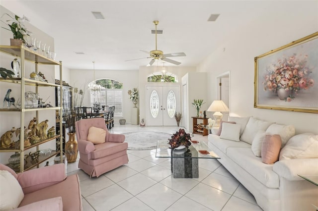 8704 Cypress Lakes Blvd, New Port Richey, FL 34653 - living room with light tile patterned floors, ceiling fan, and a chandelier