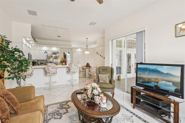 8704 Cypress Lakes Blvd, New Port Richey, FL 34653 - living area featuring a ceiling fan, light tile patterned floors, and french doors