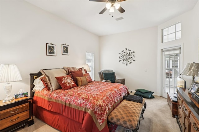 8704 Cypress Lakes Blvd, New Port Richey, FL 34653 - bedroom featuring light colored carpet, multiple windows, and ceiling fan
