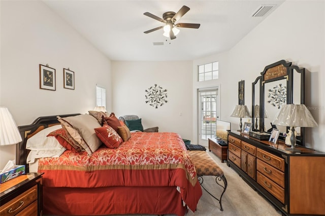 8704 Cypress Lakes Blvd, New Port Richey, FL 34653 - bedroom with light colored carpet, access to outside, and a ceiling fan
