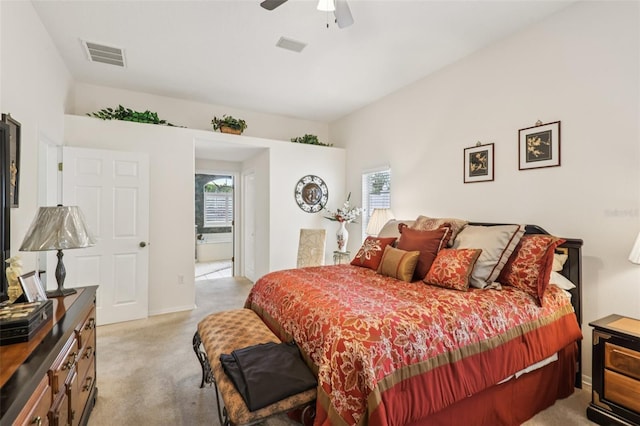 8704 Cypress Lakes Blvd, New Port Richey, FL 34653 - bedroom featuring light carpet, a ceiling fan, and connected bathroom