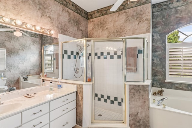 8704 Cypress Lakes Blvd, New Port Richey, FL 34653 - bathroom with a garden tub, a stall shower, vanity, wallpapered walls, and ceiling fan