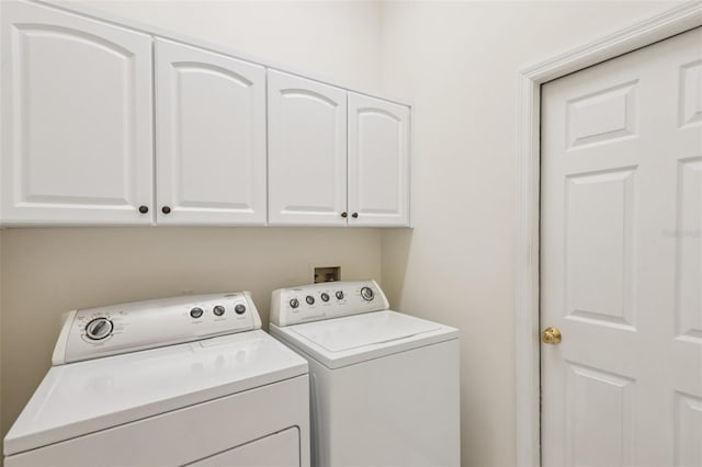 8704 Cypress Lakes Blvd, New Port Richey, FL 34653 - laundry room with washing machine and clothes dryer and cabinet space
