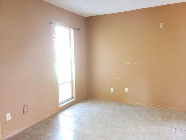 2227 Grenadier Dr Unit 140, Sun City Center, FL 33573 - unfurnished room with healthy amount of natural light and light tile patterned flooring