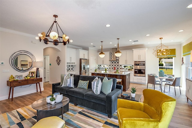 18469 Purple Creek Ln, Lutz, FL 33549 - living area with a chandelier, light wood-style floors, crown molding, recessed lighting, and arched walkways