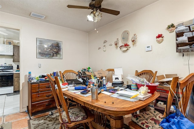 712 Divot Ln, Poinciana, FL 34759 - dining room with a ceiling fan and light tile patterned floors