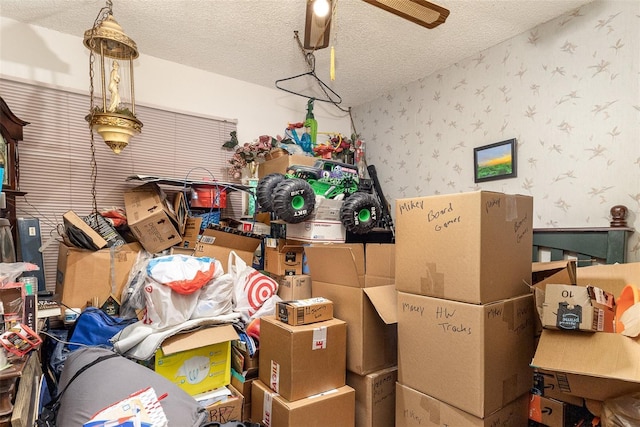 712 Divot Ln, Poinciana, FL 34759 - garage featuring wallpapered walls and a ceiling fan