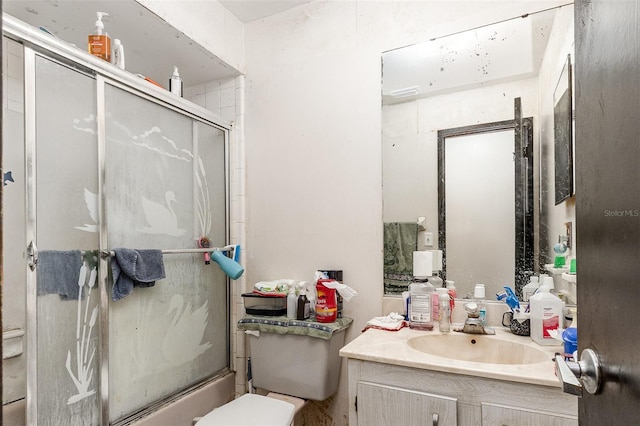 712 Divot Ln, Poinciana, FL 34759 - bathroom with vanity and bath / shower combo with glass door