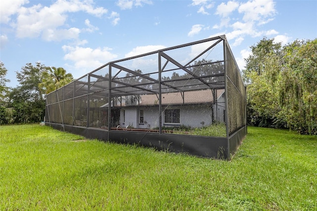 712 Divot Ln, Poinciana, FL 34759 - rear view of property featuring a yard and a lanai