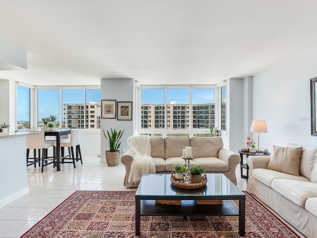 660 Island Way Unit 703, Clearwater Beach, FL 33767 - living room with light tile patterned floors and baseboards