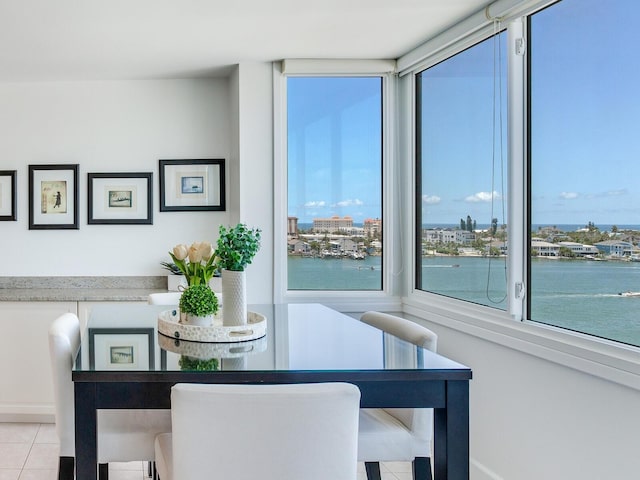 660 Island Way Unit 703, Clearwater Beach, FL 33767 - dining room featuring tile patterned flooring and a water view