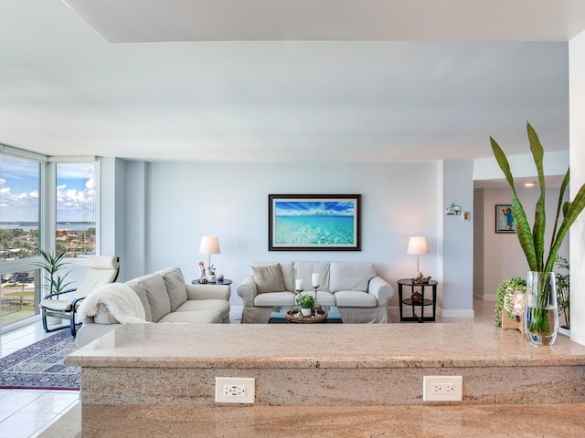 660 Island Way Unit 703, Clearwater Beach, FL 33767 - living area with tile patterned floors and baseboards