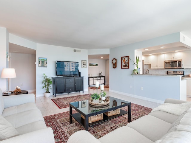 660 Island Way Unit 703, Clearwater Beach, FL 33767 - living area with light tile patterned floors and recessed lighting