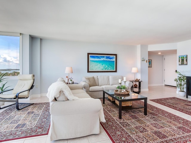 660 Island Way Unit 703, Clearwater Beach, FL 33767 - living room featuring light tile patterned floors and baseboards