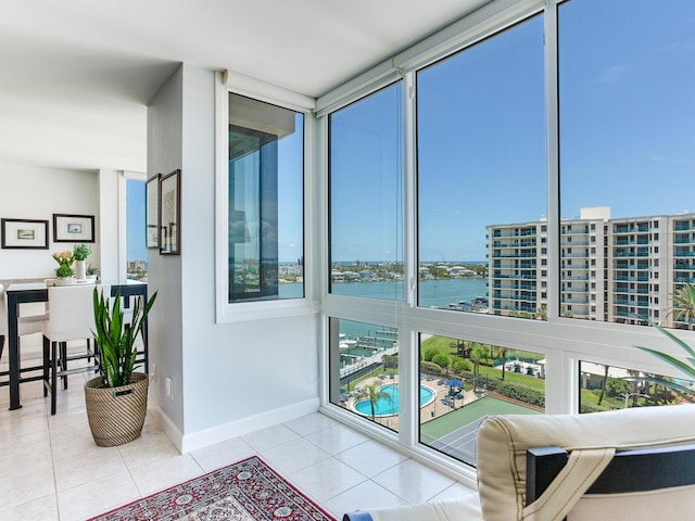 660 Island Way Unit 703, Clearwater Beach, FL 33767 - sunroom with plenty of natural light and a water view