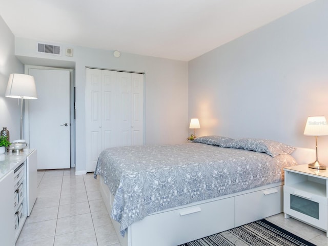 660 Island Way Unit 703, Clearwater Beach, FL 33767 - bedroom with a closet and light tile patterned flooring