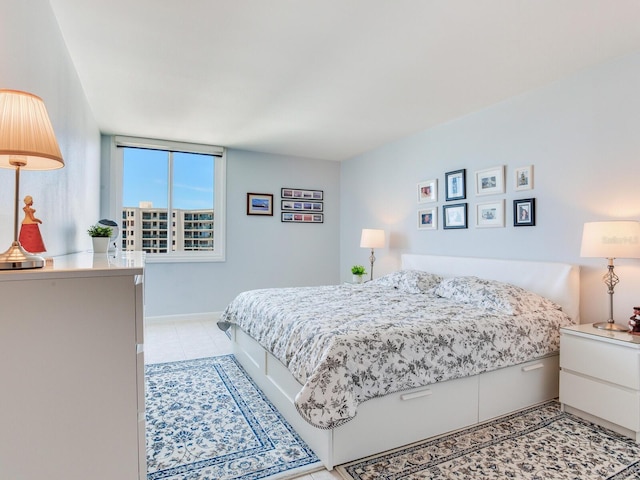660 Island Way Unit 703, Clearwater Beach, FL 33767 - bedroom featuring light tile patterned flooring and baseboards