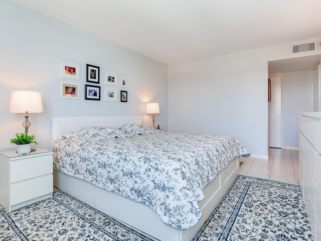 660 Island Way Unit 703, Clearwater Beach, FL 33767 - bedroom featuring light tile patterned floors and baseboards