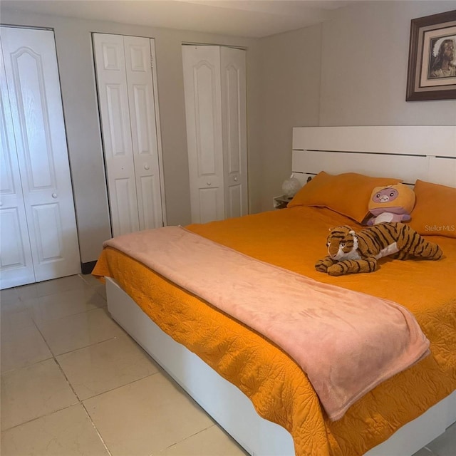 10004 Ethel St, Gibsonton, FL 33534 - bedroom with two closets and light tile patterned floors